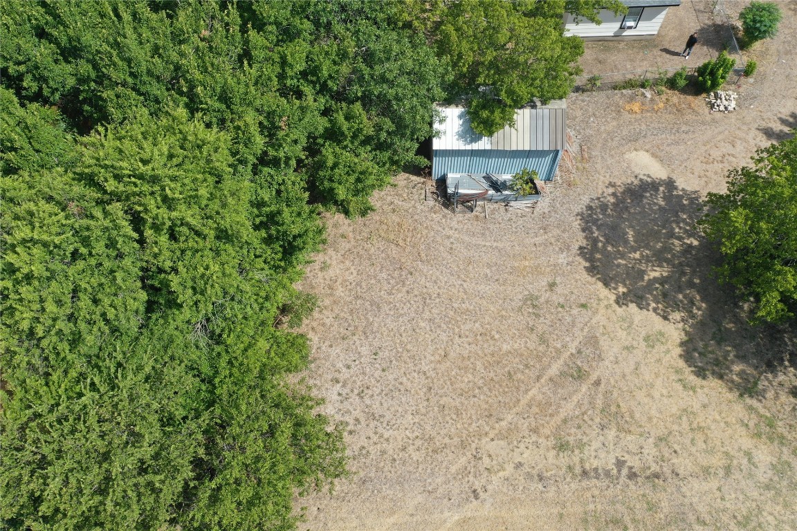 910 East 20th Street Georgetown, TX 78626 - Photo 17 of 19 a view of a backyard with chairs