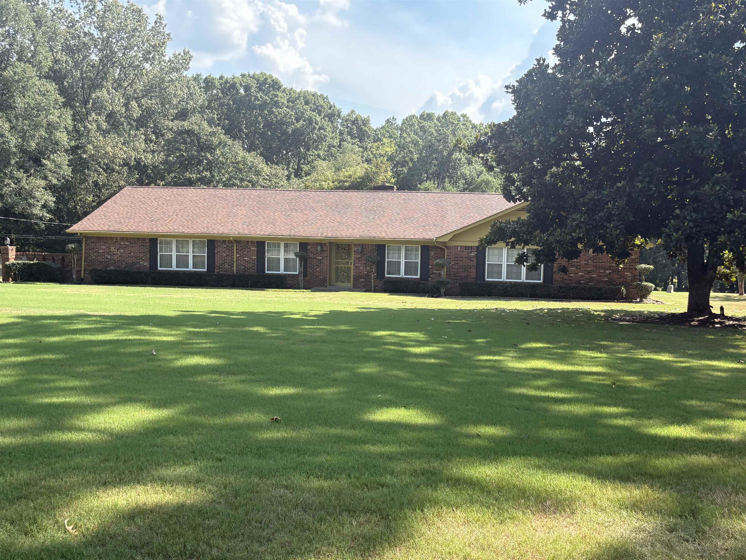 8355 Craven Road Bartlett, TN 38002 - Photo 1 of 28 Ranch-style home with a front yard and brick siding