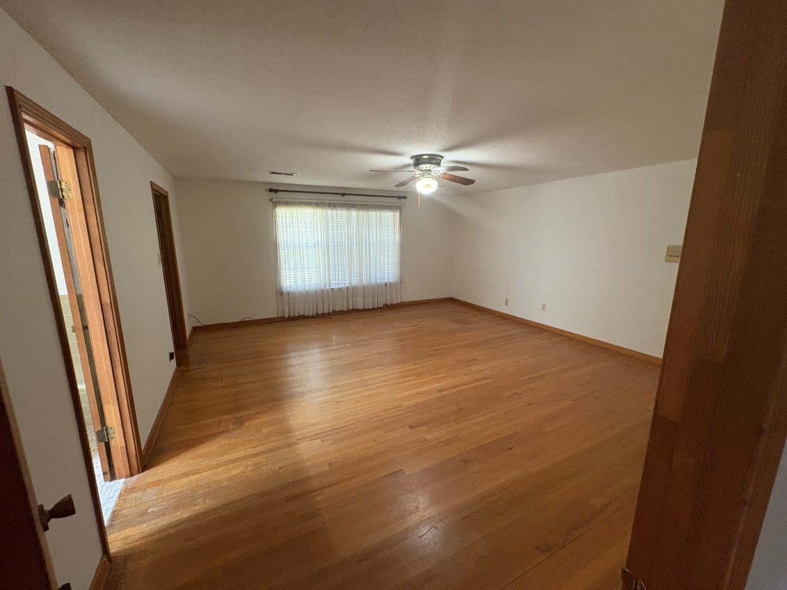 8355 Craven Road Bartlett, TN 38002 - Photo 15 of 28 Primary Bedroom with light wood-type flooring and a ceiling fan