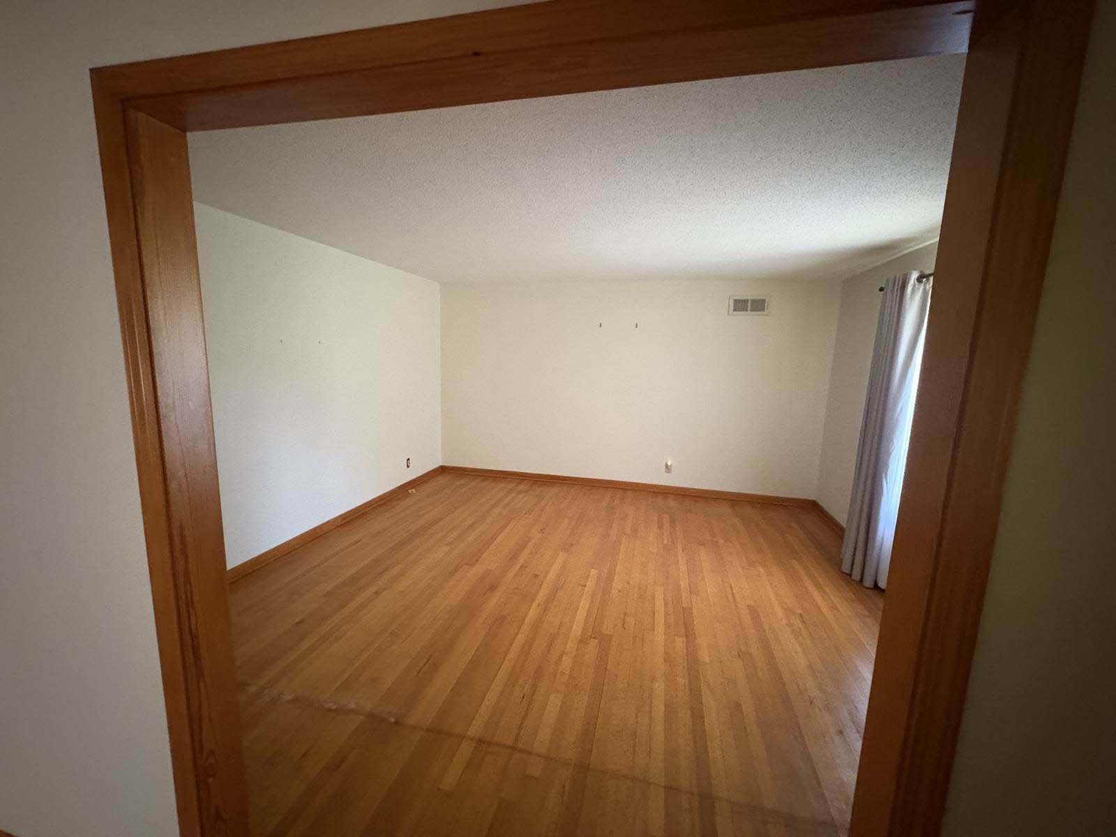 8355 Craven Road Bartlett, TN 38002 - Photo 16 of 28 Empty room featuring light wood finished floors and a textured ceiling