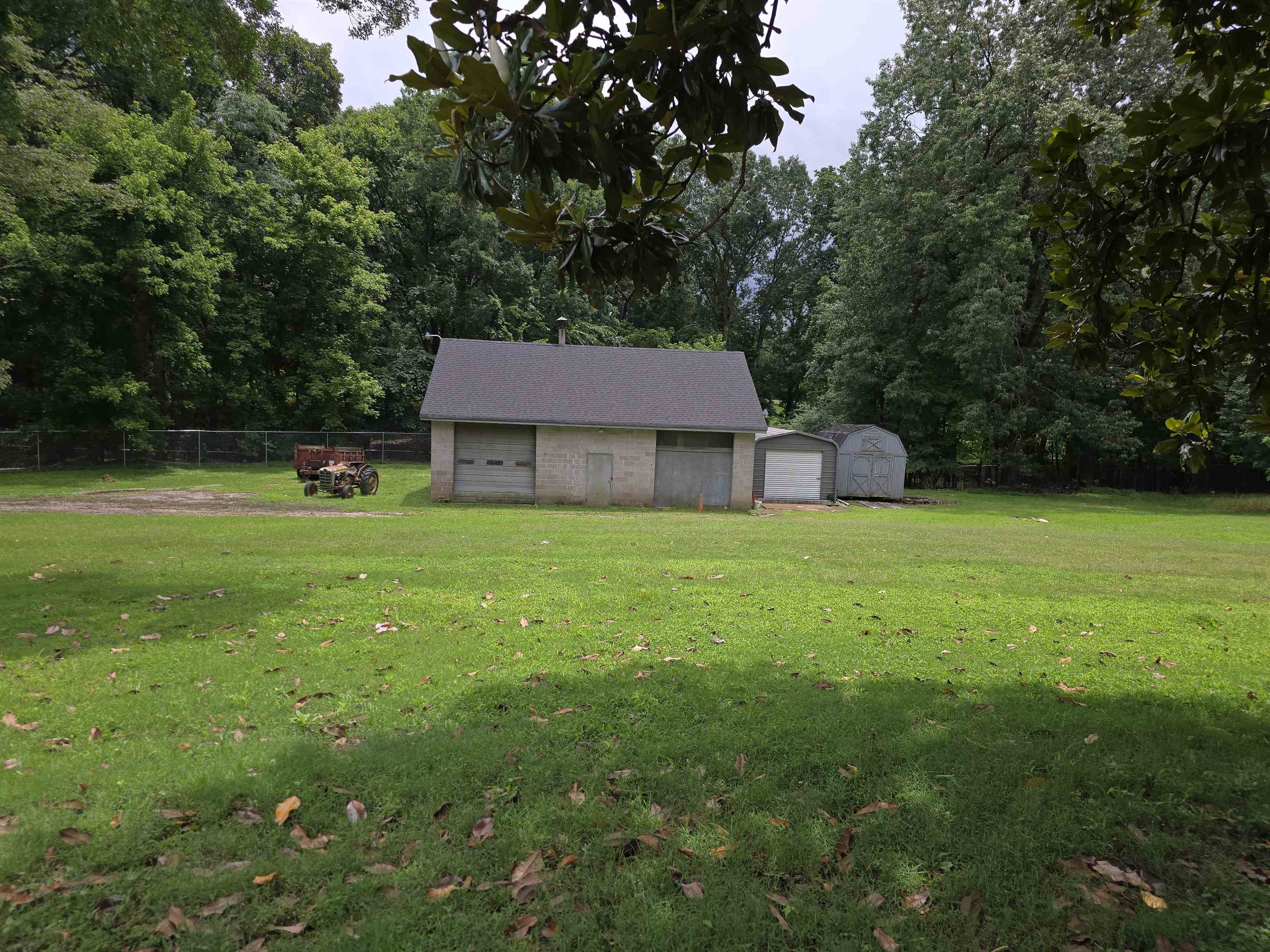 8355 Craven Road Bartlett, TN 38002 - Photo 2 of 28 View of yard featuring a detached garage and a storage unit