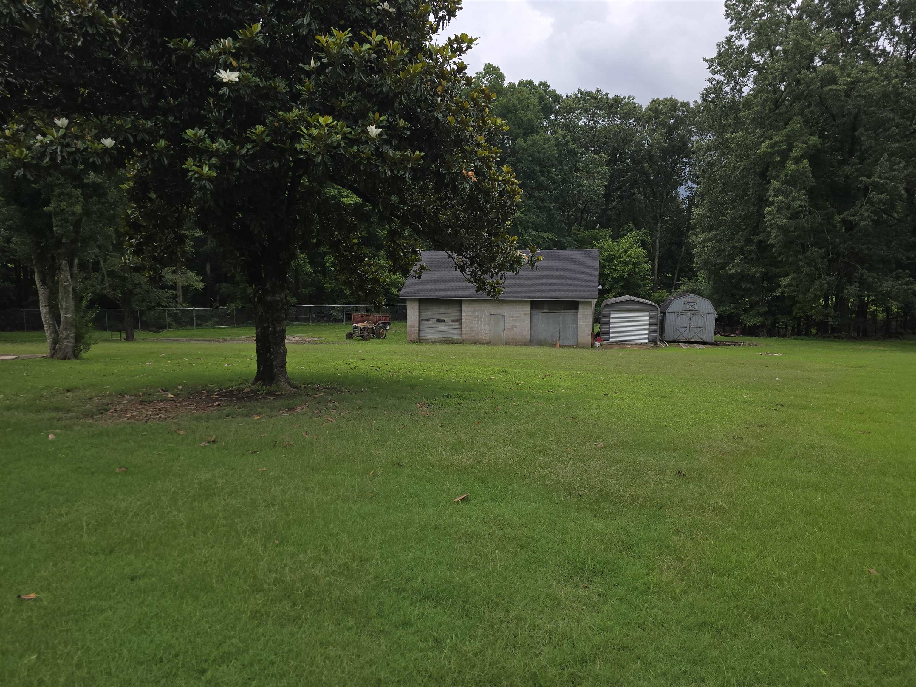 8355 Craven Road Bartlett, TN 38002 - Photo 3 of 28 View of yard featuring a garage and a storage shed