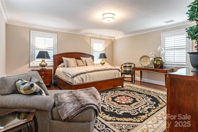 a bedroom with double bed and a window