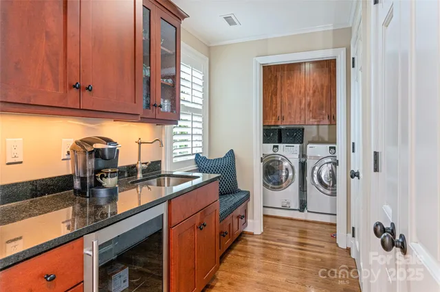 a kitchen with stainless steel appliances granite countertop a sink and cabinets