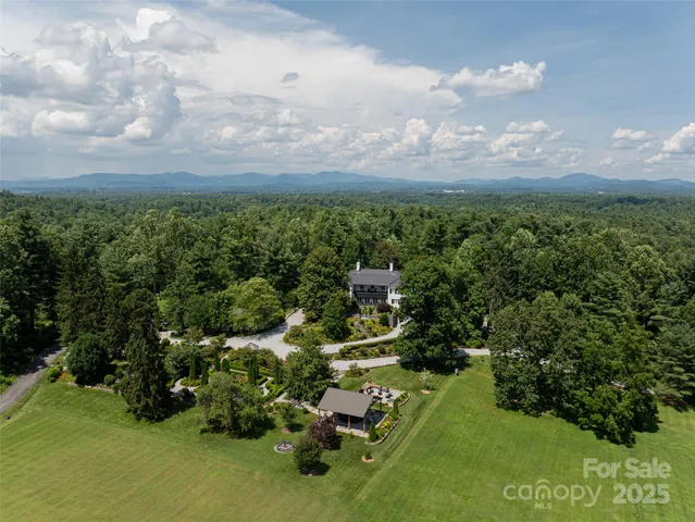 an aerial view of residential house with outdoor space
