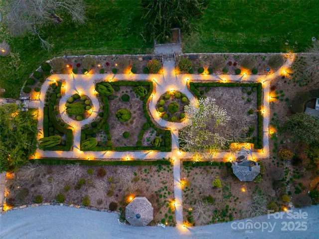an aerial view of a house with a swimming pool