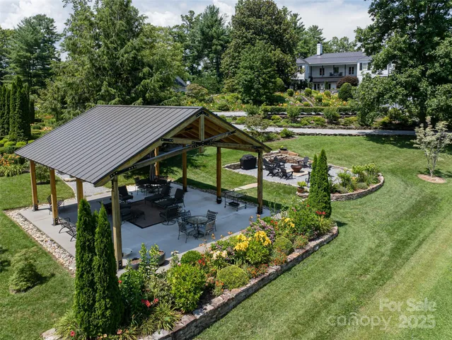 an aerial view of residential houses with outdoor space and street view
