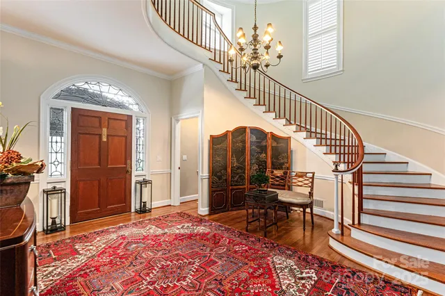 a view of a livingroom with furniture and staircase