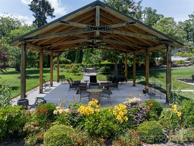 a view of swimming pool with sitting area and furniture