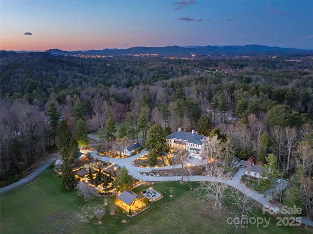 a view of a lake in front of a house