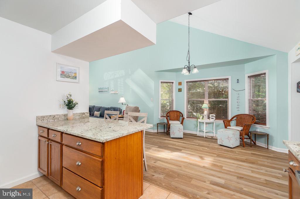 51 Martinique Circle Ocean Pines, MD 21811 - Photo 12 of 49 a living room with furniture a large window and a chandelier