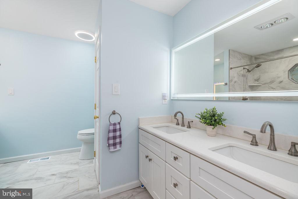 51 Martinique Circle Ocean Pines, MD 21811 - Photo 18 of 49 a bathroom with a sink and a mirror