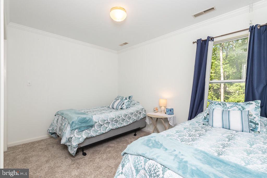 51 Martinique Circle Ocean Pines, MD 21811 - Photo 25 of 49 a bedroom with two beds and a large window