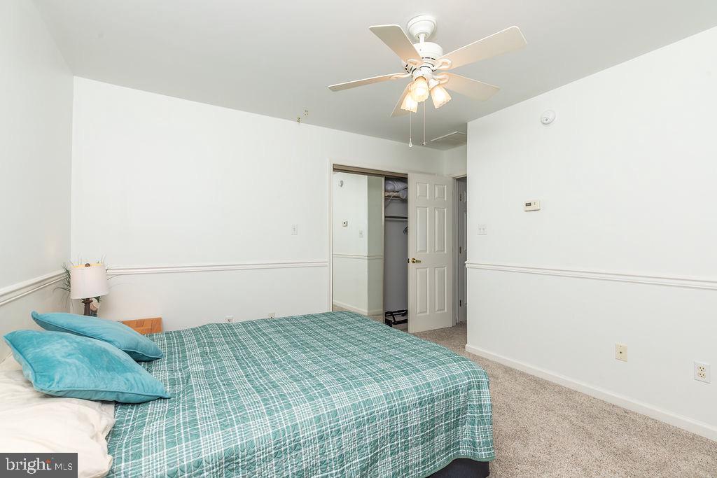 51 Martinique Circle Ocean Pines, MD 21811 - Photo 30 of 49 a bedroom with a bed and a ceiling fan