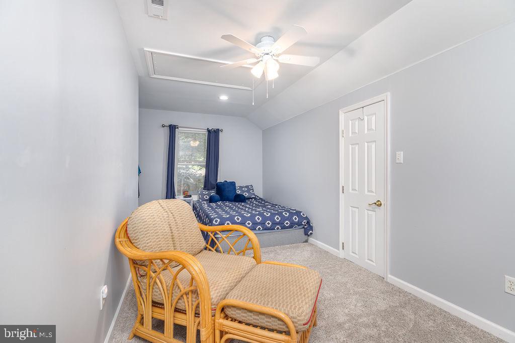 51 Martinique Circle Ocean Pines, MD 21811 - Photo 31 of 49 a bedroom with furniture and a chandelier fan