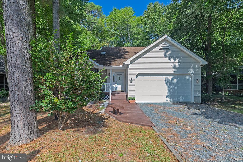 51 Martinique Circle Ocean Pines, MD 21811 - Photo 38 of 49 a front view of a house with a yard and garage