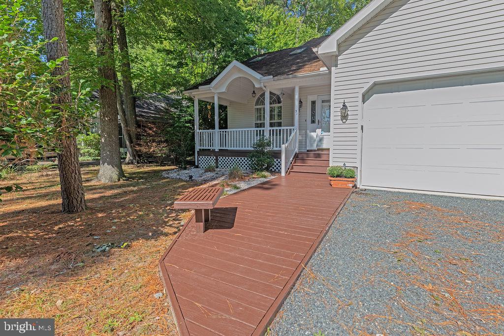 51 Martinique Circle Ocean Pines, MD 21811 - Photo 39 of 49 a view of a patio with chairs and wooden fence