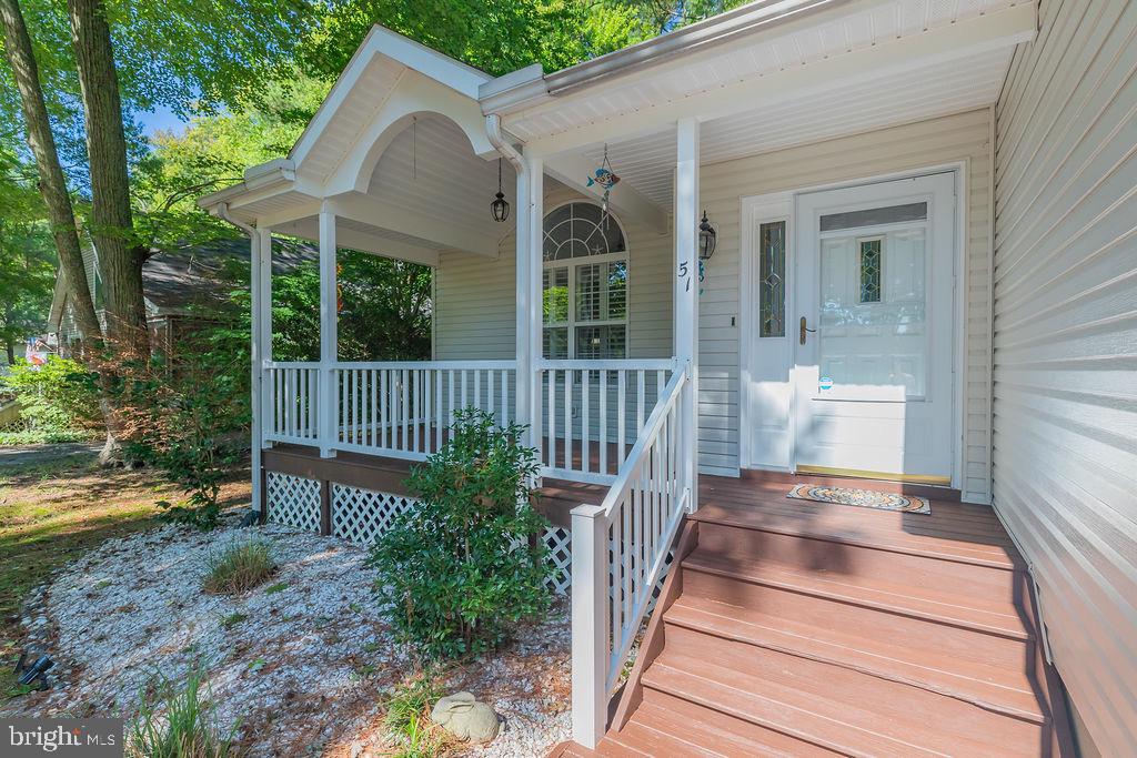 51 Martinique Circle Ocean Pines, MD 21811 - Photo 40 of 49 a view of a house with a small yard and wooden floor and fence