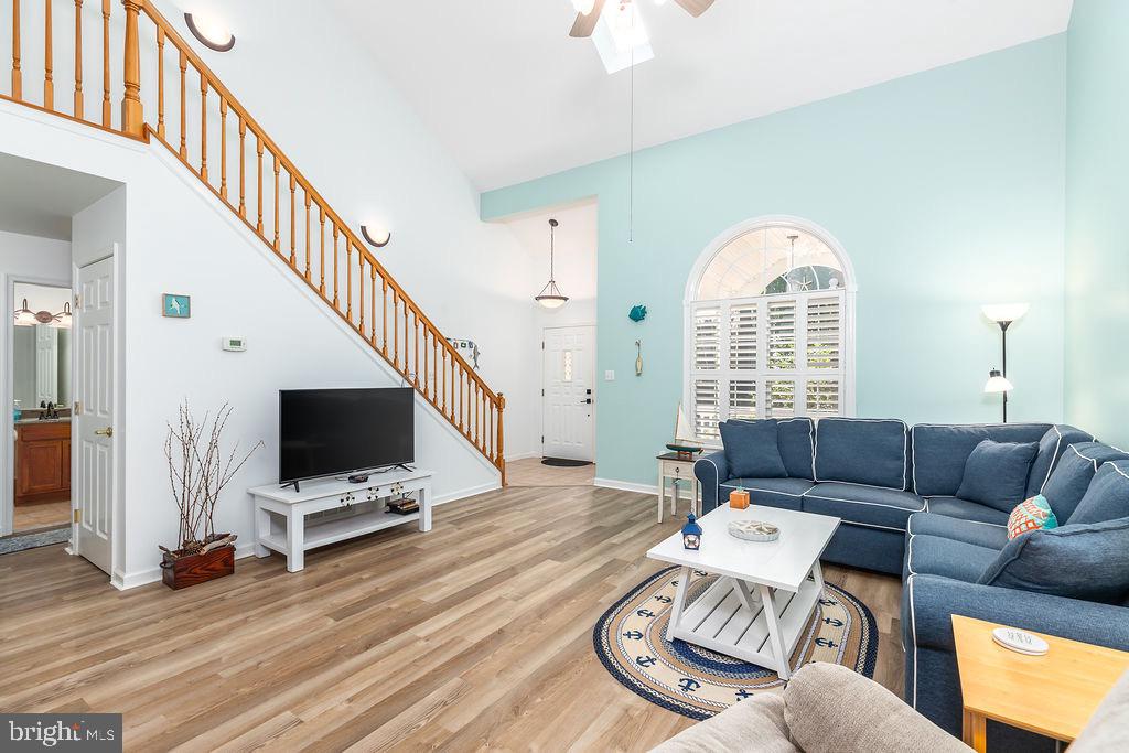51 Martinique Circle Ocean Pines, MD 21811 - Photo 5 of 49 a living room with furniture a flat screen tv and a large window