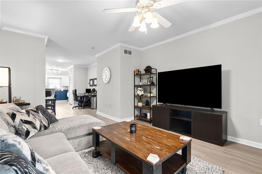 3675 Peachtree Road Northeast, Unit 45 Atlanta, GA 30319 - Photo 7 of 42 a living room with furniture and a flat screen tv
