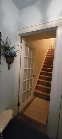 a view of entryway with wooden floor