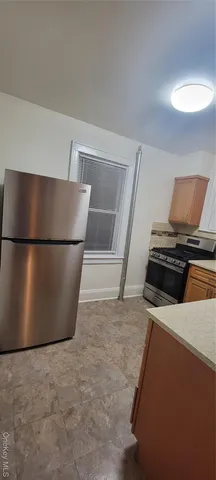 a view of a refrigerator in kitchen
