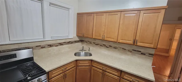 a view of a kitchen with a sink