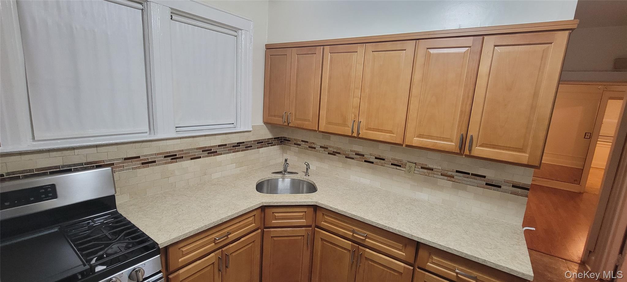 31-22 100th Street, Unit 2 Queens, NY 11369 - Photo 8 of 11 a view of a kitchen with a sink