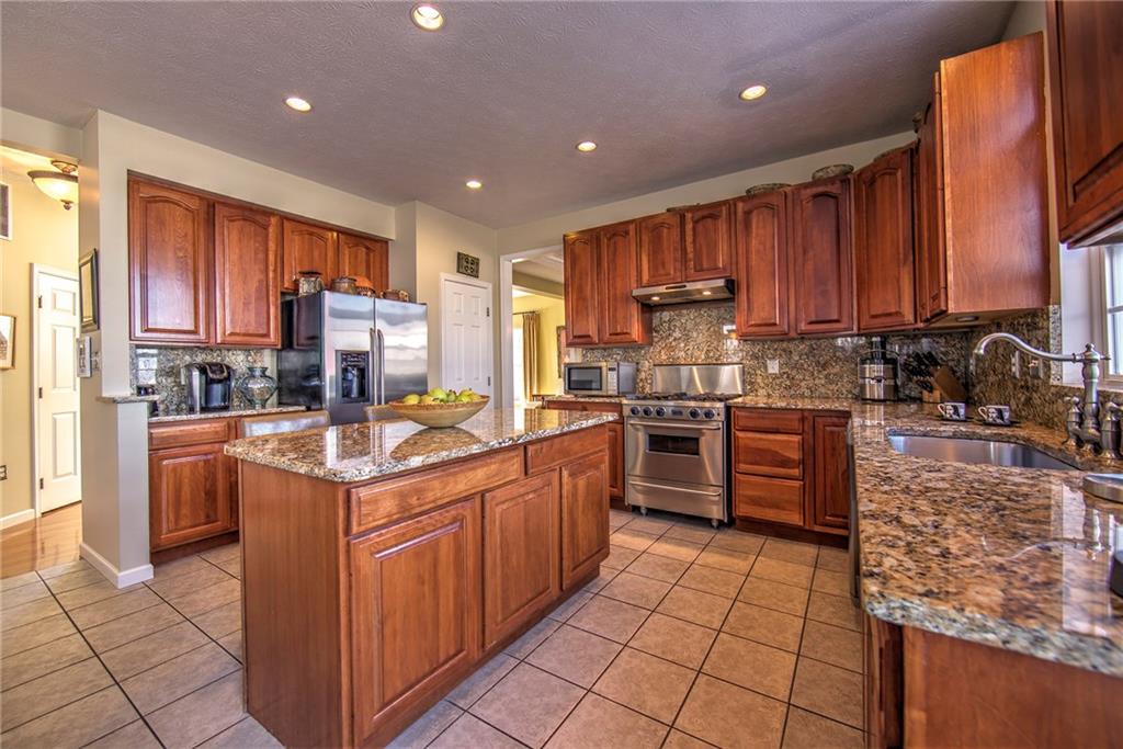 252 Field Club Circle McKees Rocks, PA 15136 - Photo 5 of 24 Eat-in kitchen with granite, commercial stove...
