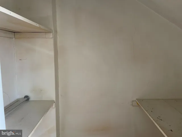 a bathroom with a granite countertop sink and vanity