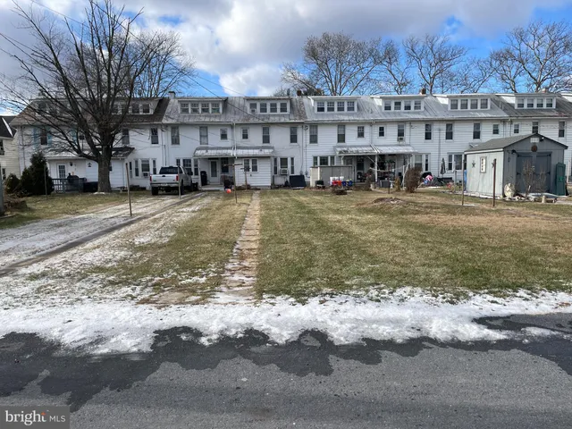 a view of a large building with a large pool