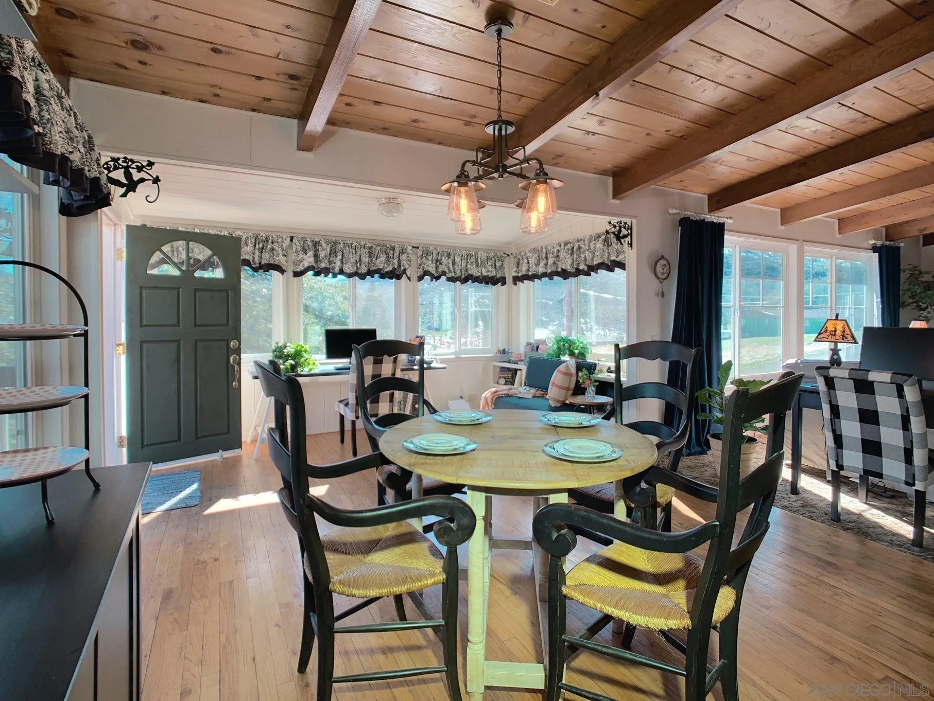 34642 Navajo Road Julian, CA 92036 - Photo 11 of 32 a view of a dining room with furniture and wooden floor