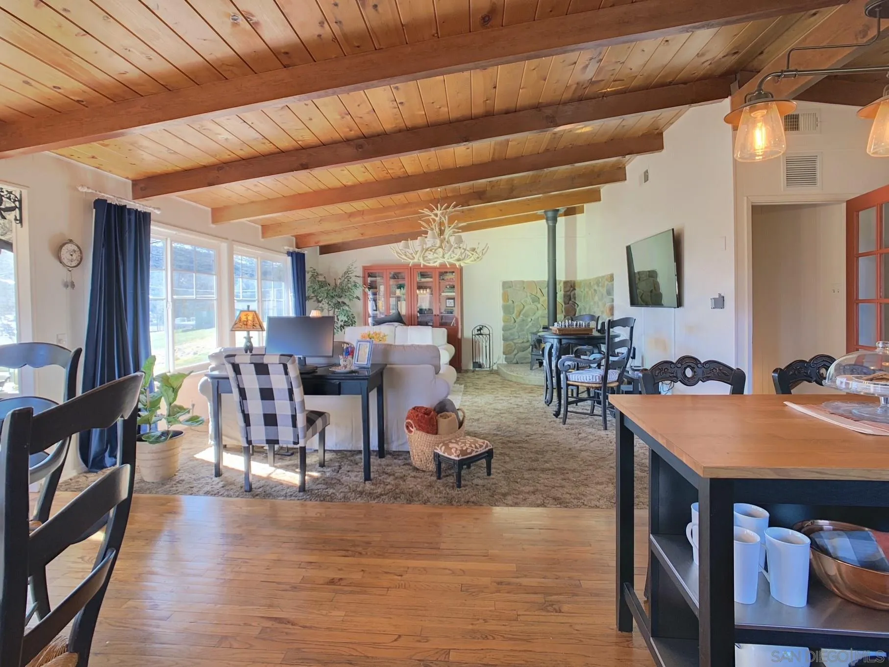 34642 Navajo Road Julian, CA 92036 - Photo 12 of 32 a view of a dining room with furniture and wooden floor