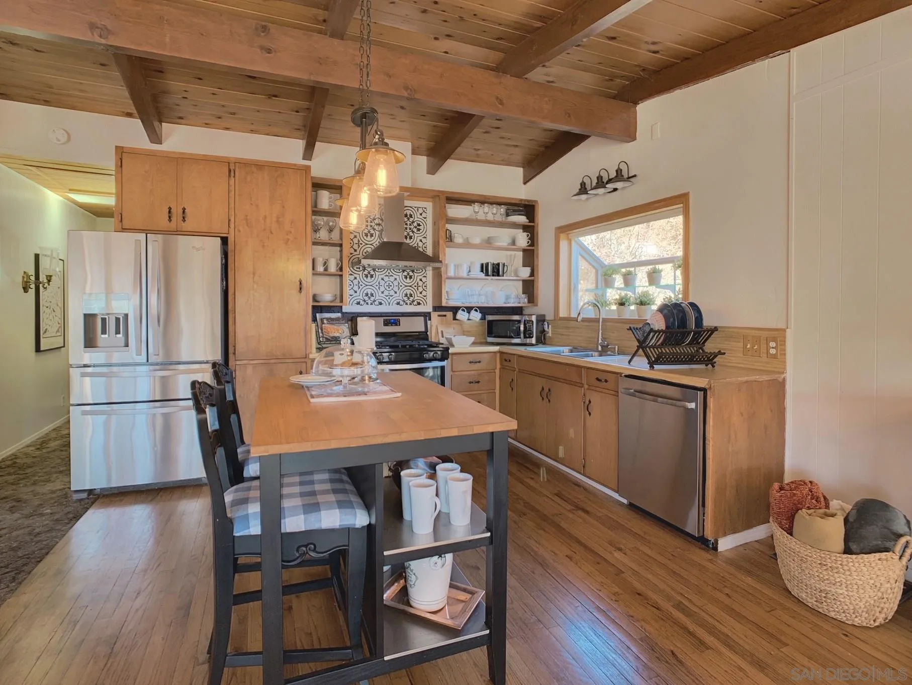 34642 Navajo Road Julian, CA 92036 - Photo 14 of 32 a kitchen with granite countertop a sink appliances and wooden floor