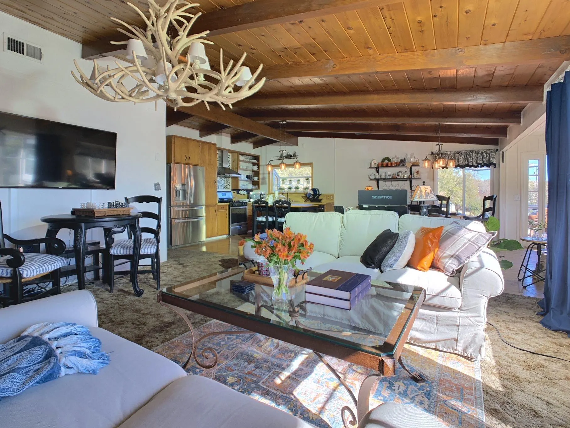 34642 Navajo Road Julian, CA 92036 - Photo 16 of 32 a living room with lots of furniture and a chandelier