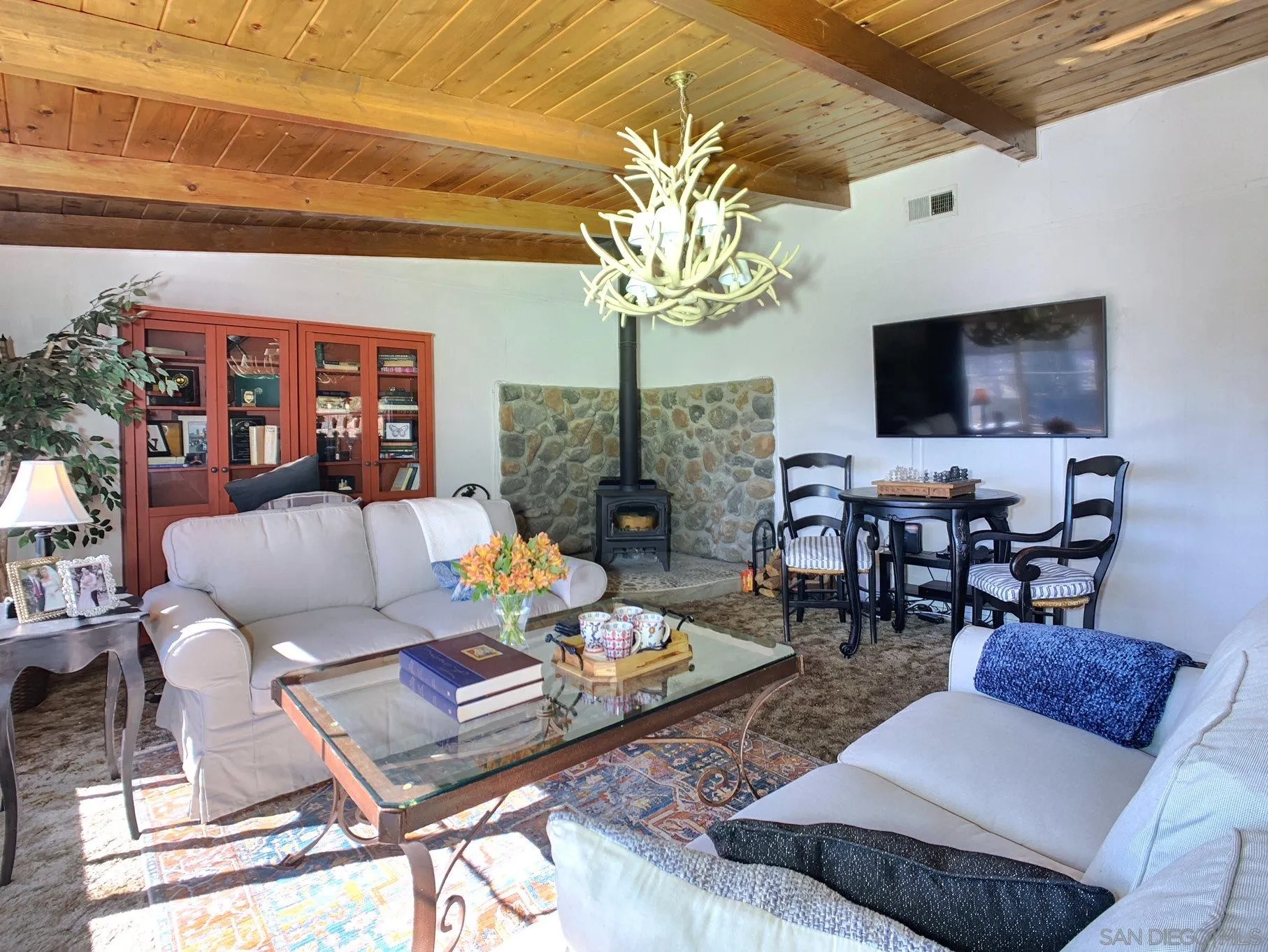 34642 Navajo Road Julian, CA 92036 - Photo 19 of 32 a living room with fireplace furniture and a flat screen tv