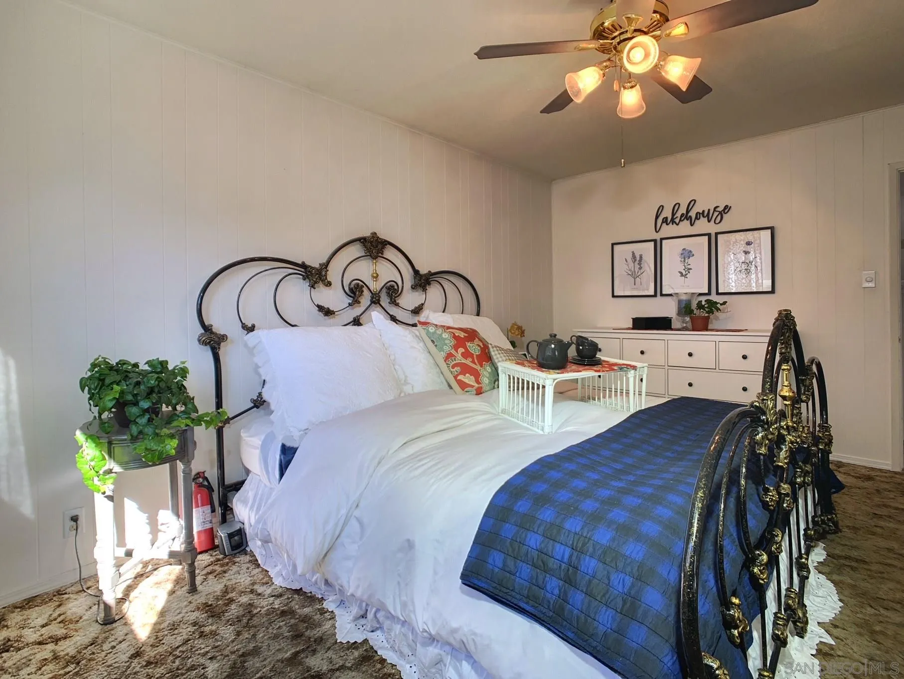 34642 Navajo Road Julian, CA 92036 - Photo 20 of 32 a bedroom with bed and a chandelier