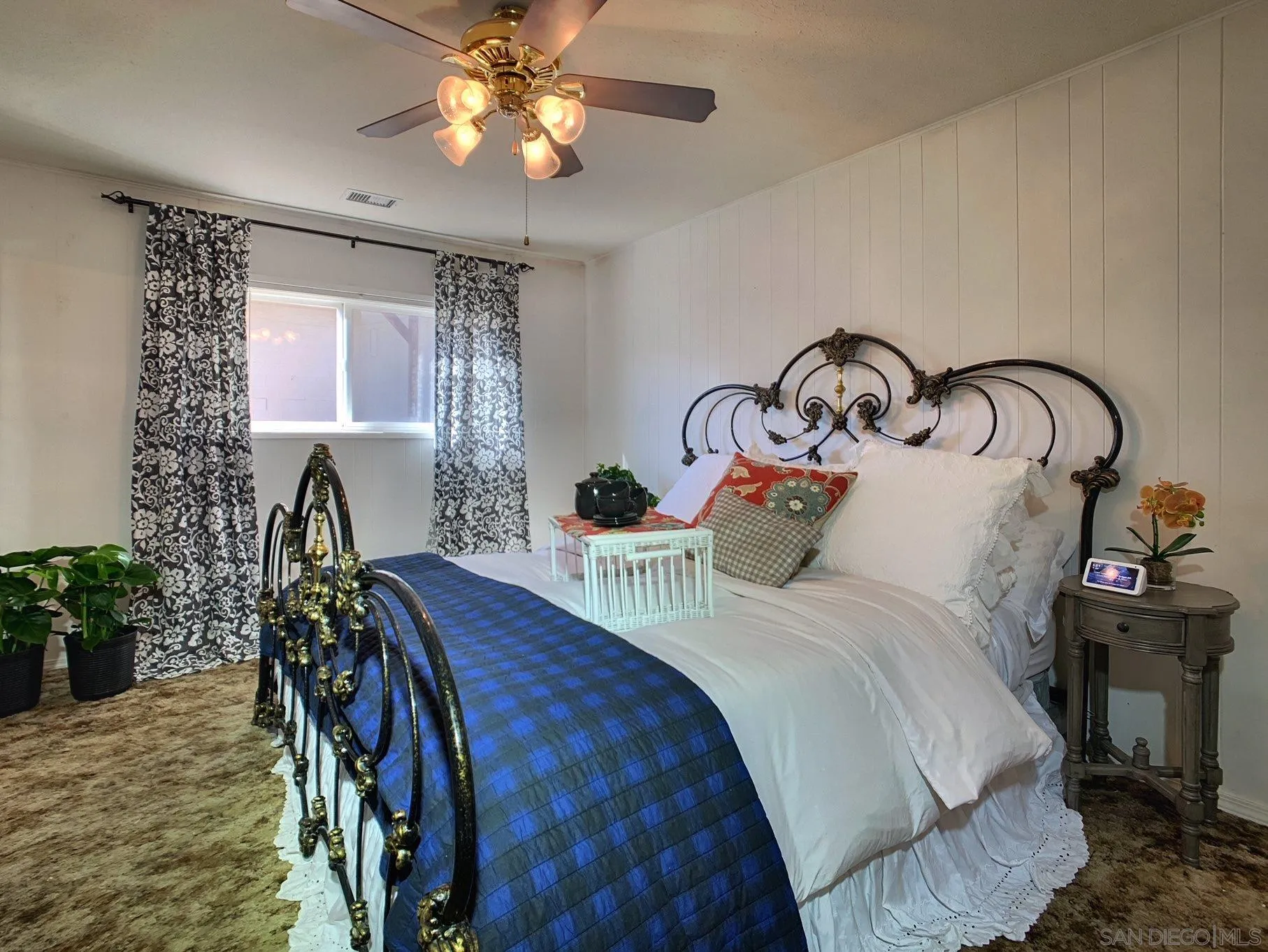 34642 Navajo Road Julian, CA 92036 - Photo 21 of 32 a bedroom with bed and a chandelier