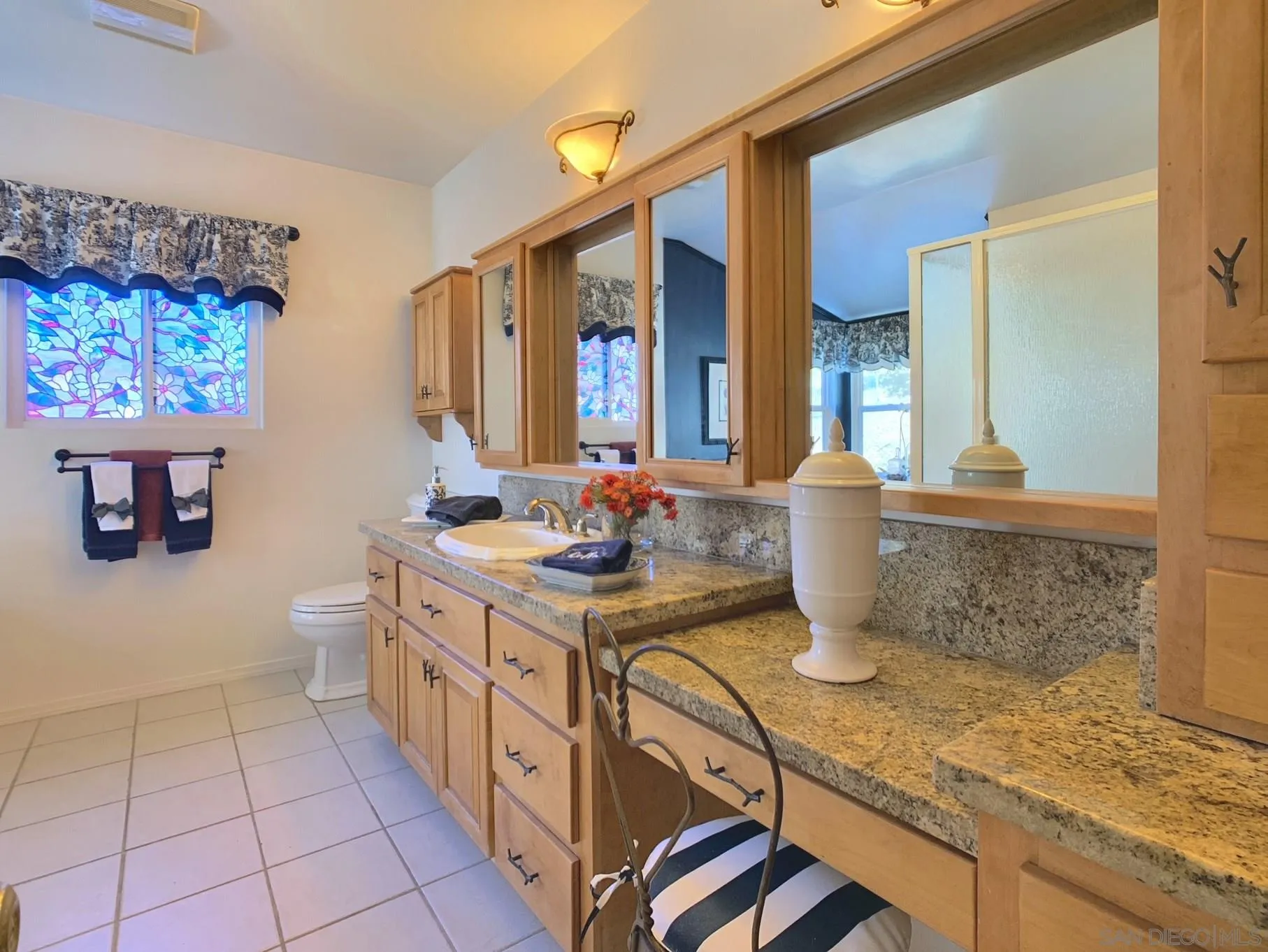 34642 Navajo Road Julian, CA 92036 - Photo 24 of 32 a bathroom with a granite countertop sink a toilet and a mirror