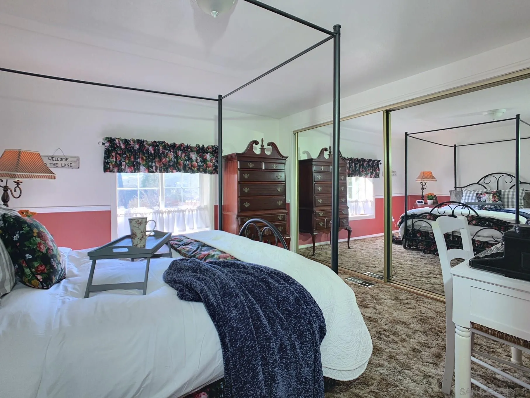 34642 Navajo Road Julian, CA 92036 - Photo 25 of 32 a bedroom with a bed mirror and a window
