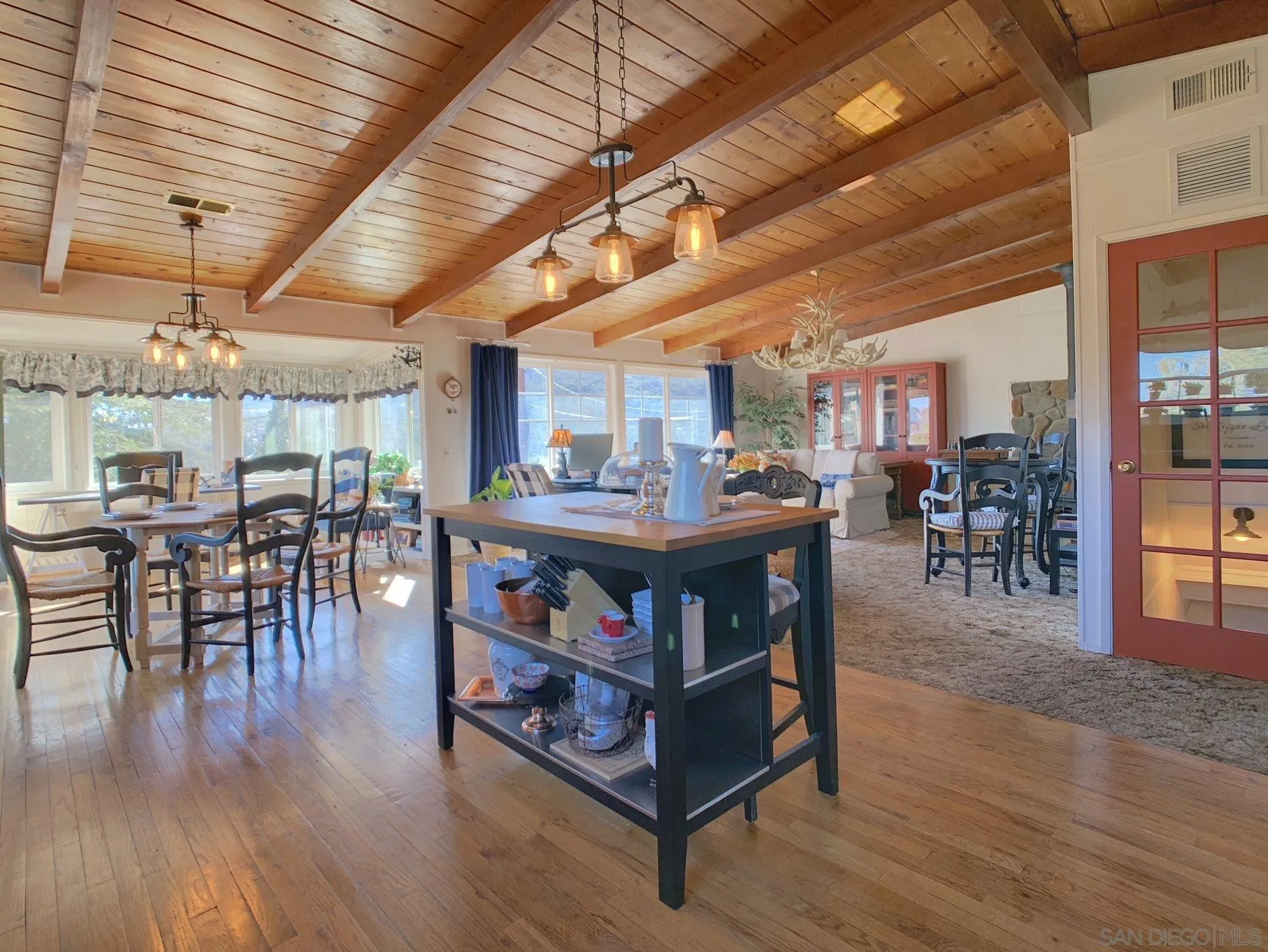 34642 Navajo Road Julian, CA 92036 - Photo 9 of 32 a view of a dining room with furniture wooden floor and chandelier