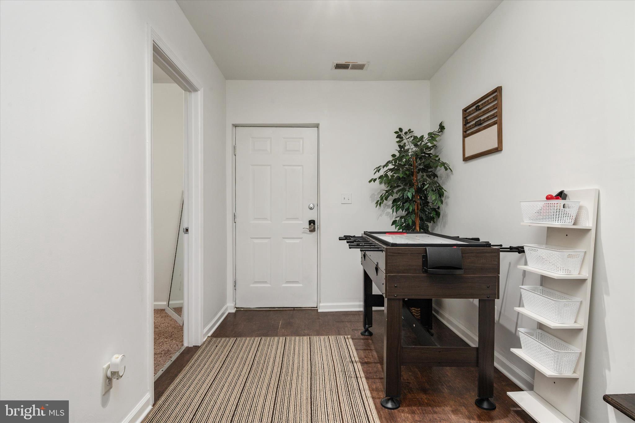 108 Wilson Road Grasonville, MD 21658 - Photo 22 of 38 a workspace with furniture and wooden floor