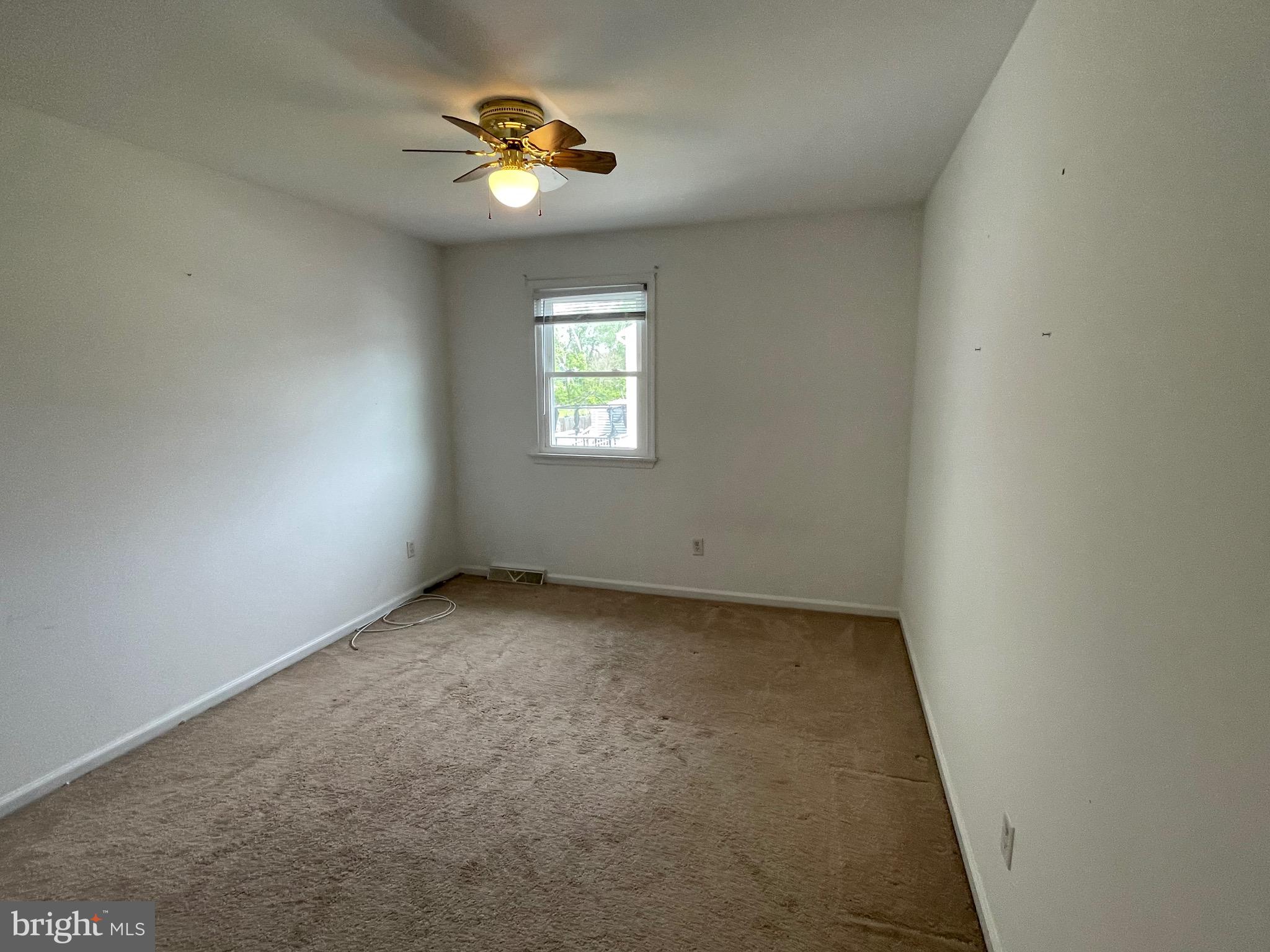 3314 Roxbury Road Hatfield, PA 19440 - Photo 22 of 26 an empty room with a window and a fan