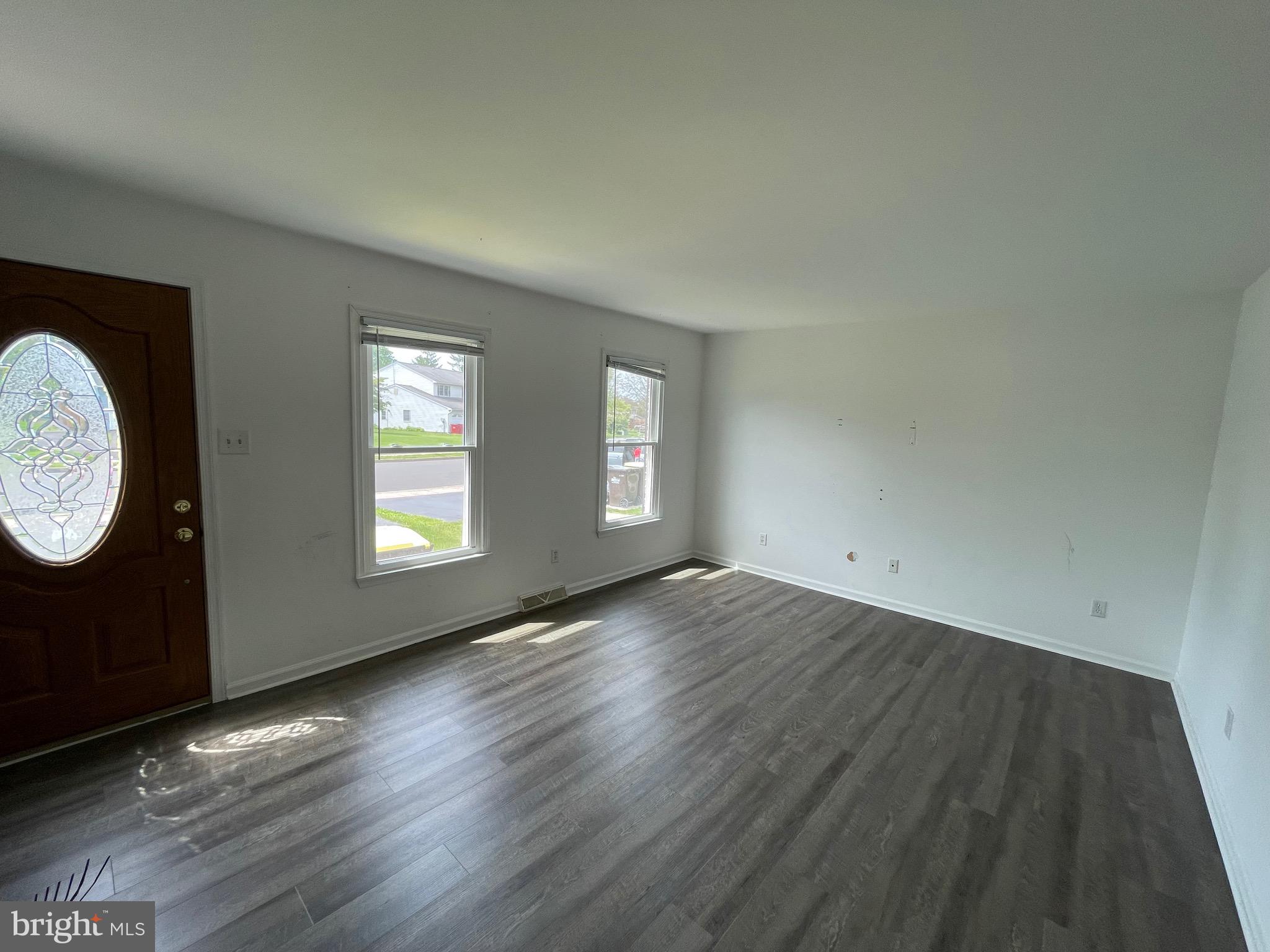 3314 Roxbury Road Hatfield, PA 19440 - Photo 3 of 26 an empty room with wooden floor and window