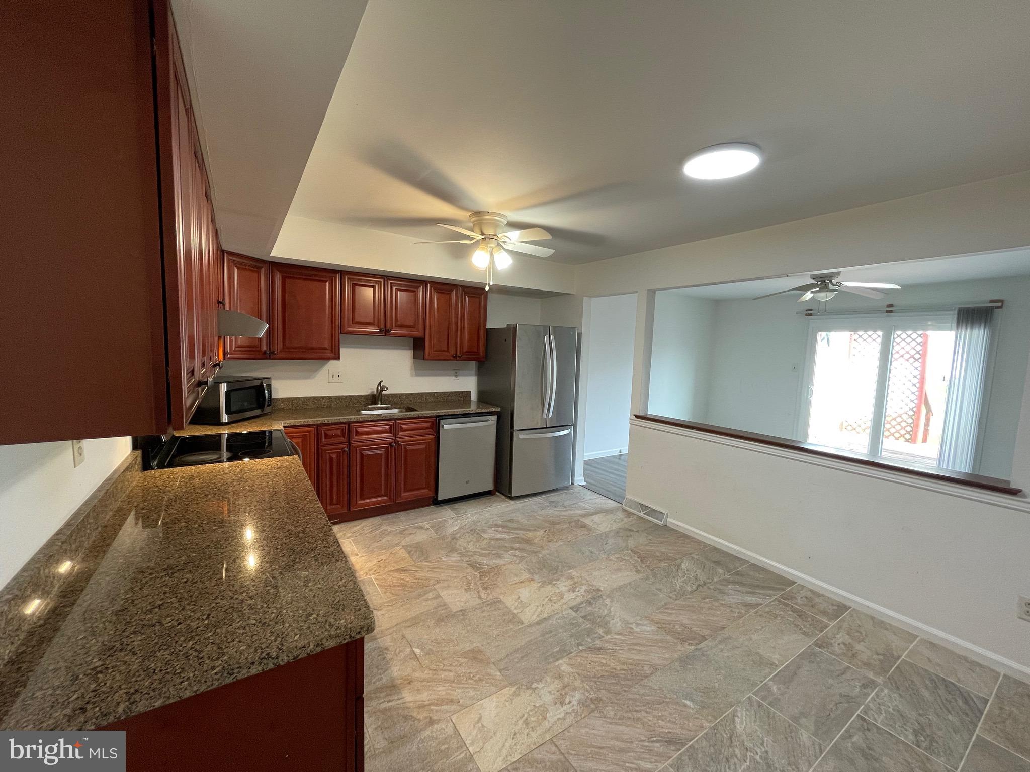 3314 Roxbury Road Hatfield, PA 19440 - Photo 8 of 26 a kitchen with stainless steel appliances granite countertop a stove sink and cabinets