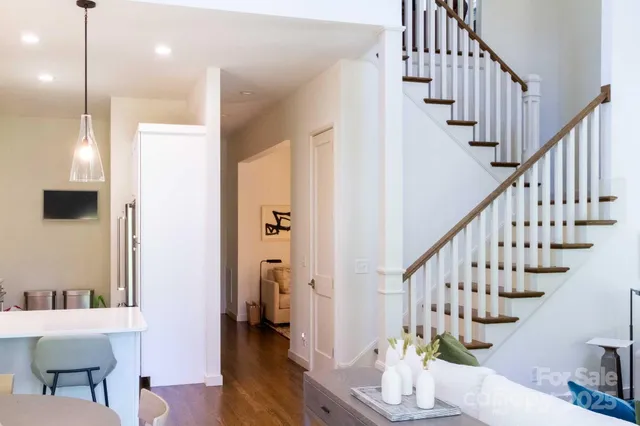 a view of entryway and hall with wooden floor