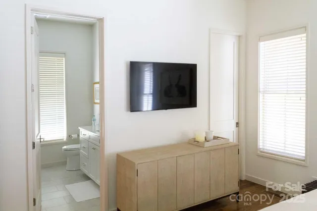 a bathroom with a sink toilet and mirror