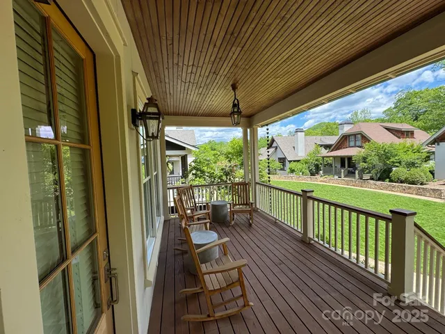 a view of a balcony with chairs