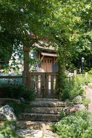 a house with a tree in front of it