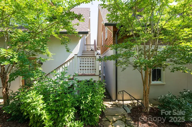 a green field with trees in front of it